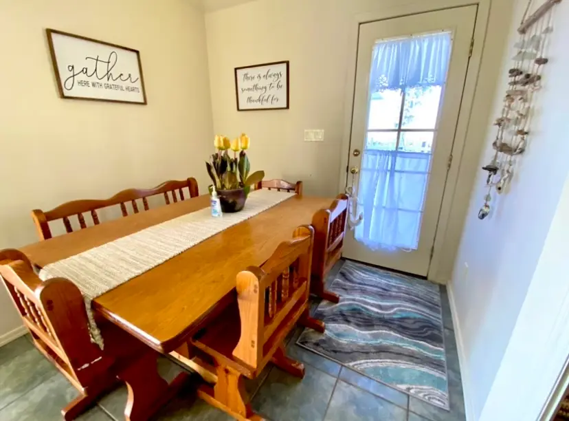 The dining room and its long farmhouse table